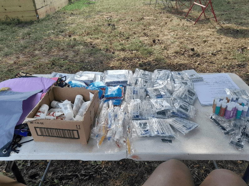 Volunteers with Philly People of Hope distributing medical kits to community members.