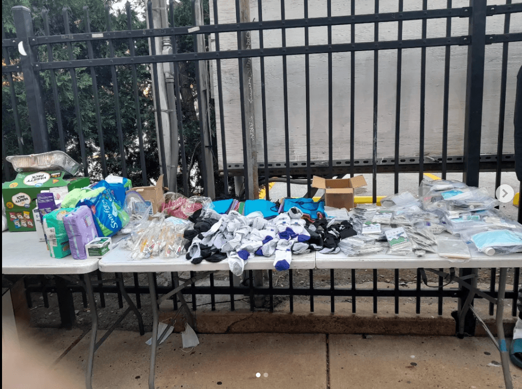 A table with organized supplies, hygiene items, and resources ready for distribution